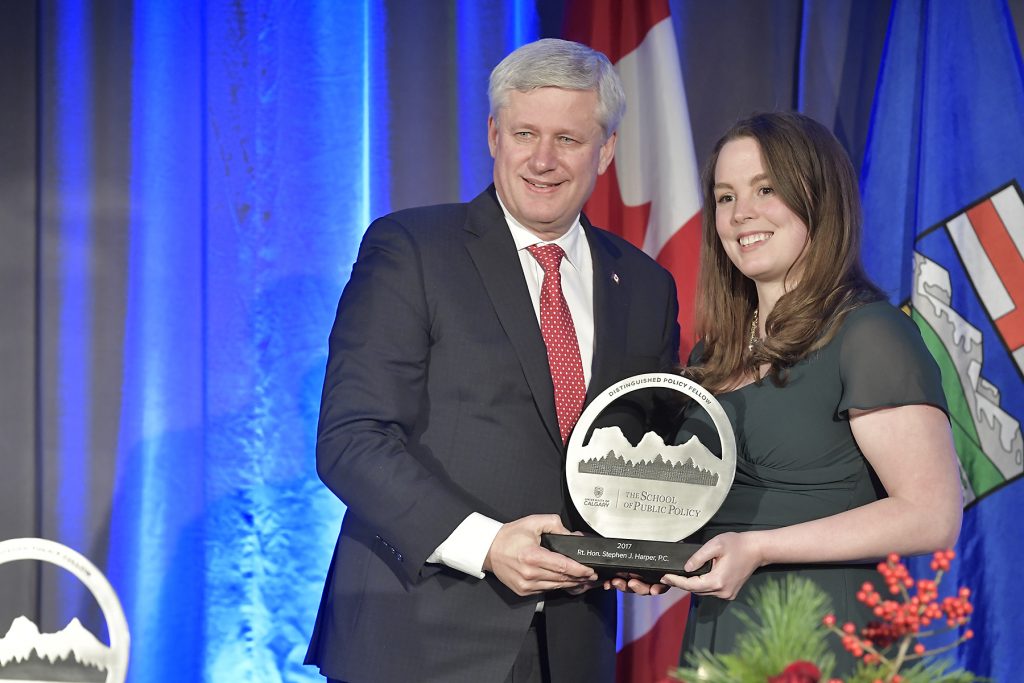 Allison Robins, MPP'15 , presents the Distinguished Policy Fellow award to The Rt. Hon. Stephen J. Harper, P.C.